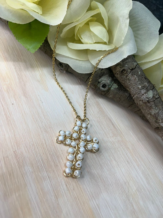 Cross pendant in white beads