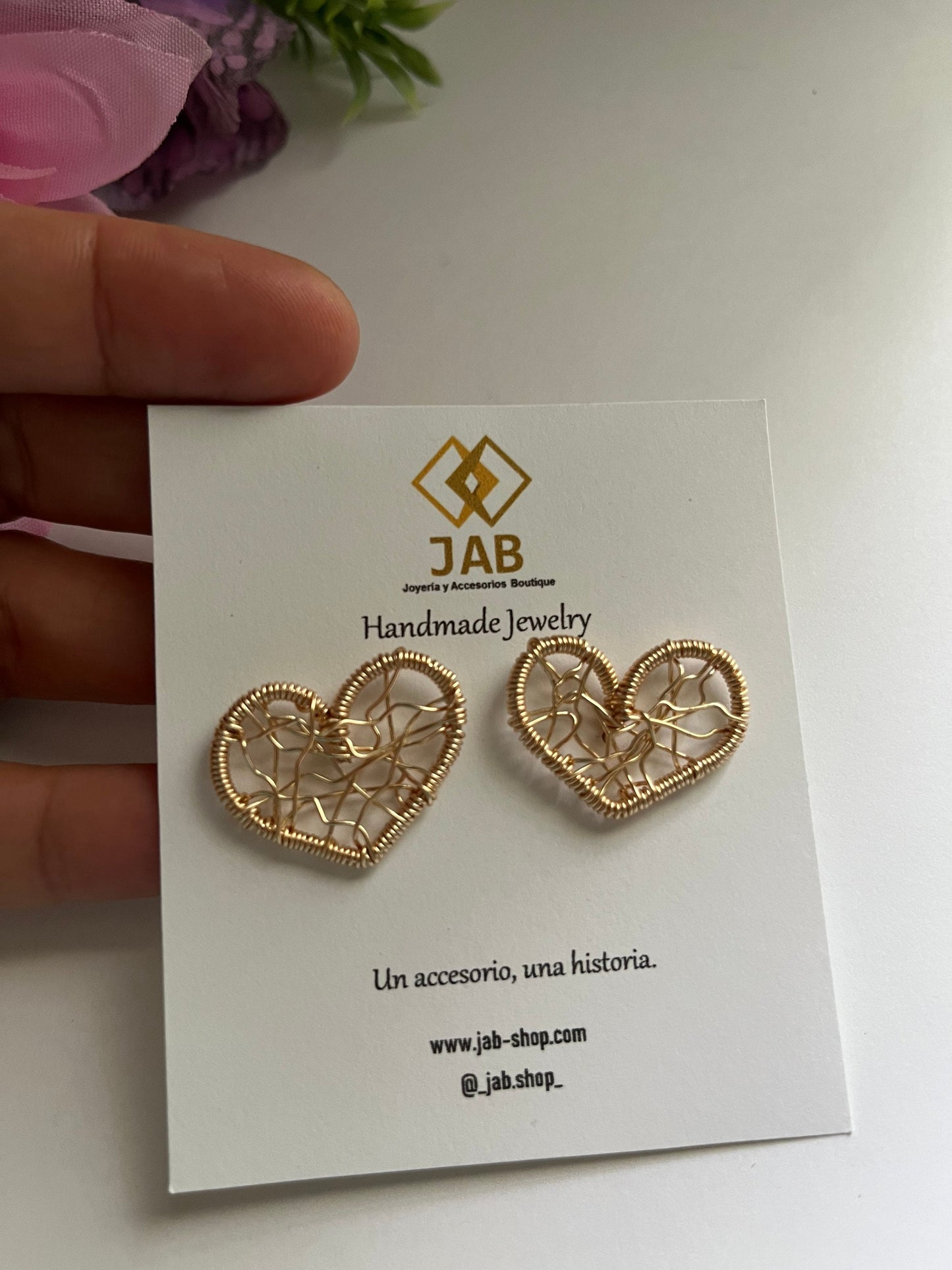 Hypoallergenic heart earrings woven in wire.