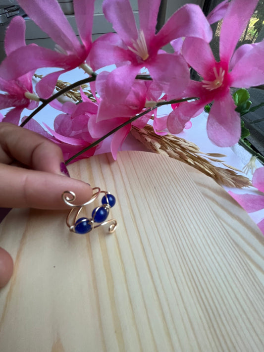 Blue crystal adjustable ring.